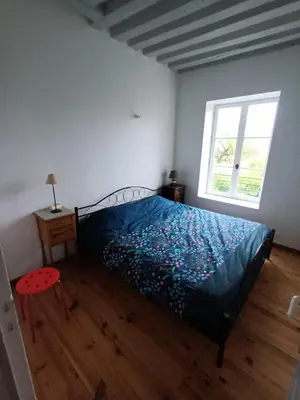 Un ou plusieurs lits dans un hébergement de l'établissement Chantilly Villa Quincampoix