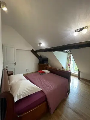 Un ou plusieurs lits dans un hébergement de l'établissement Appartement 1 chambre et Mezzanine