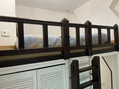 Un ou plusieurs lits dans un hébergement de l'établissement Appartement 1 chambre et Mezzanine