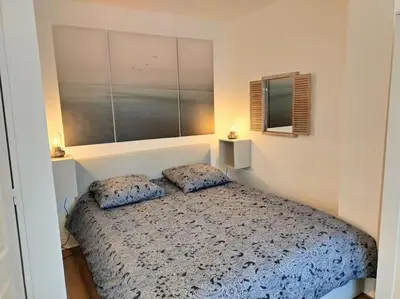 Un ou plusieurs lits dans un hébergement de l'établissement Locanoor Dieppe - Maison de Pêcheur devenue Cosy