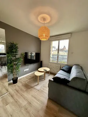 Coin salon dans l'établissement Escapade Relaxante - Spa - Jacuzzi - Sauna - Privés