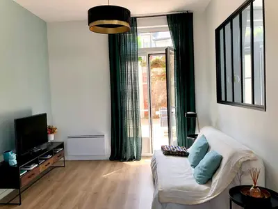 Télévision ou salle de divertissement dans l'établissement Maison Gabriel Appartement LUNE