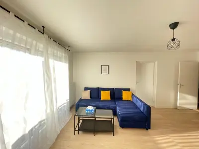Coin salon dans l'établissement Bel appartement pour 6 avec parking - Rive gauche - 183
