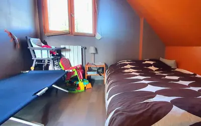 Un ou plusieurs lits dans un hébergement de l'établissement Maison lumineuse dans un cadre verdoyant