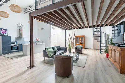 Coin salon dans l'établissement Loft & Spa LE FAUBOURG SAINT MARTIN