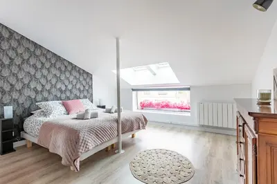 Un ou plusieurs lits dans un hébergement de l'établissement Loft & Spa LE FAUBOURG SAINT MARTIN