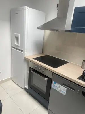 Cuisine ou kitchenette dans l'établissement Cosy house
