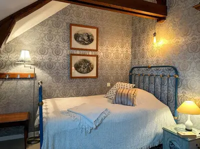 Un ou plusieurs lits dans un hébergement de l'établissement La Souveraine - Cottage - Château Le Bas Bleu