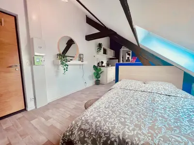 Un ou plusieurs lits dans un hébergement de l'établissement Les studios de la Villa Jules Verne