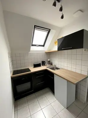 Cuisine ou kitchenette dans l'établissement L’escale proche château de chantilly