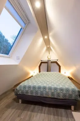 Un ou plusieurs lits dans un hébergement de l'établissement Le Puits Jaune - Gîte Nature et Spa