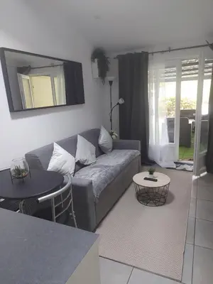 Coin salon dans l'établissement Maison annexe une chambre proche Paris
