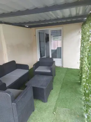 Coin salon dans l'établissement Maison annexe une chambre proche Paris