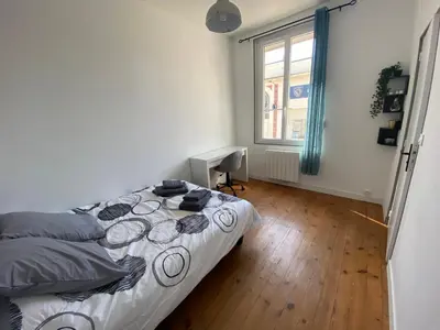 Un ou plusieurs lits dans un hébergement de l'établissement Grey Cosy