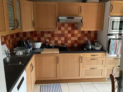 Cuisine ou kitchenette dans l'établissement Chambre meublée dans une maison
