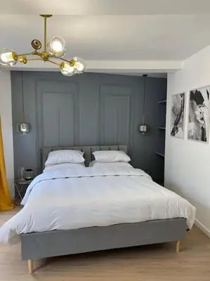 Un ou plusieurs lits dans un hébergement de l'établissement Beau duplex au centre Ville.