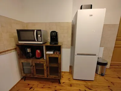 Cuisine ou kitchenette dans l'établissement Cosy Triplex 3 chambres