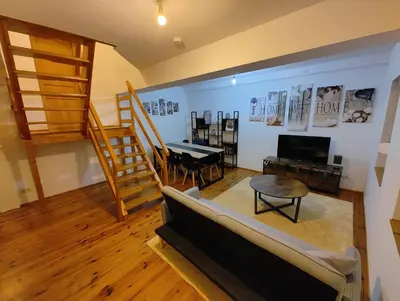 Télévision ou salle de divertissement dans l'établissement Cosy Triplex 3 chambres