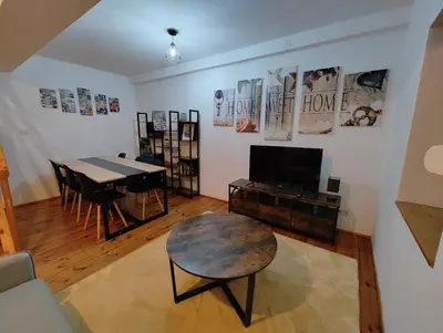 Télévision ou salle de divertissement dans l'établissement Cosy Triplex 3 chambres